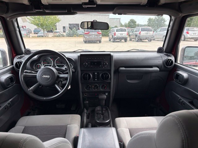 Used 2010 Jeep Wrangler Unlimited Sport with VIN 1J4BA3H16AL198615 for sale in Iowa City, IA