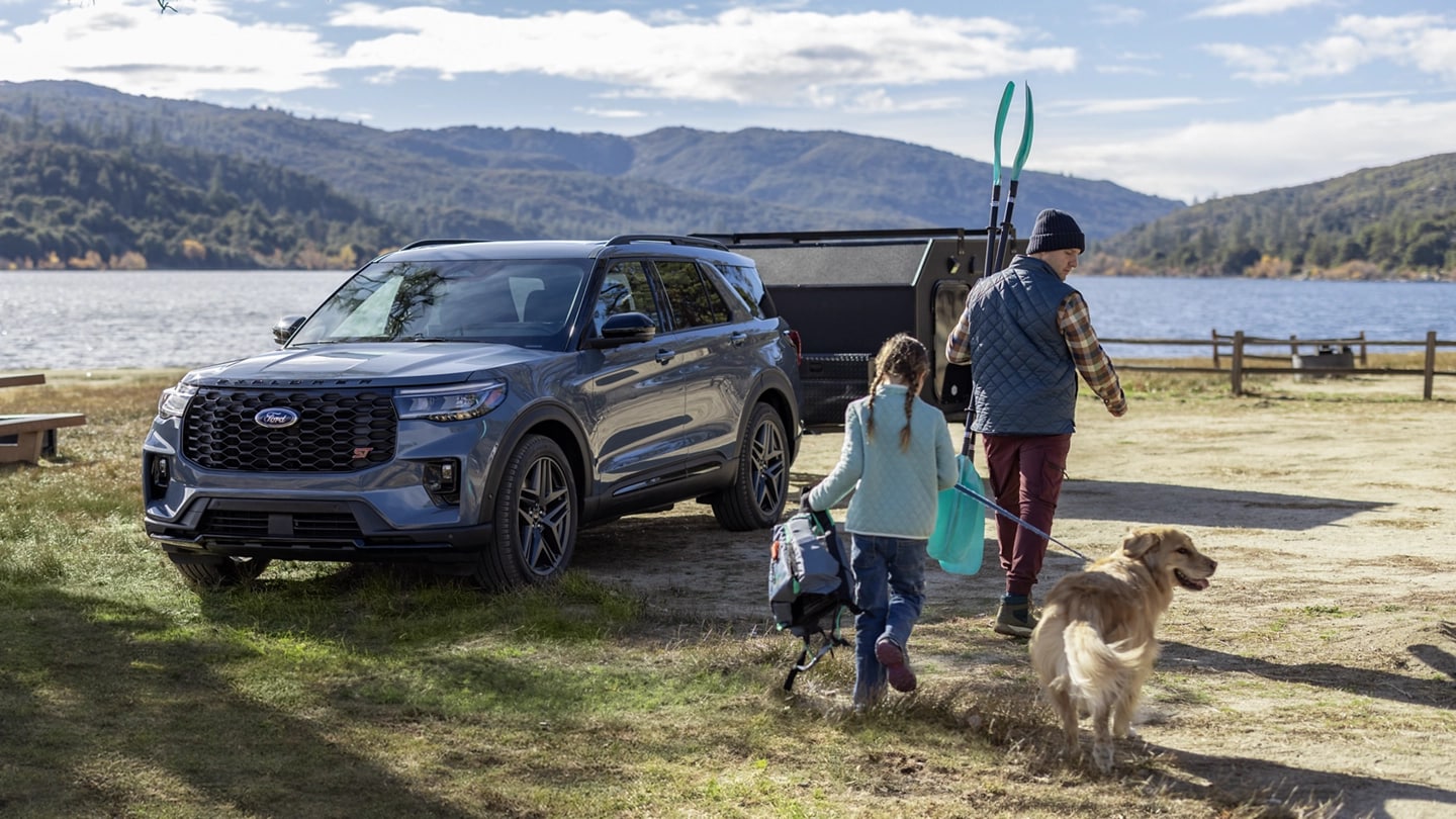 Ford Explorer in Paris, TX, with a family loading gear