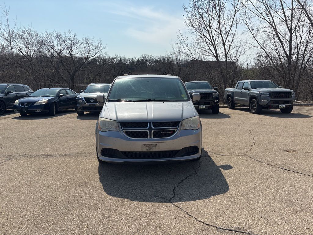 Used 2014 Dodge Grand Caravan SXT with VIN 2C4RDGCG7ER352096 for sale in Dubuque, IA
