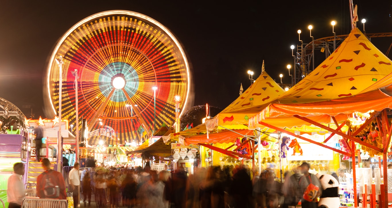 Hyundai Dealer Near Clearfield | Local fair at night with people walking by 