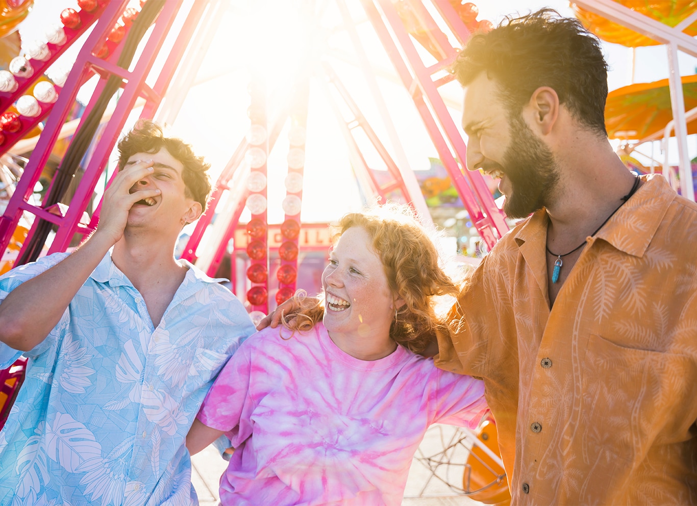 Nissan Dealer in Mt Pleasant | Group of friends laughing together at the local festival