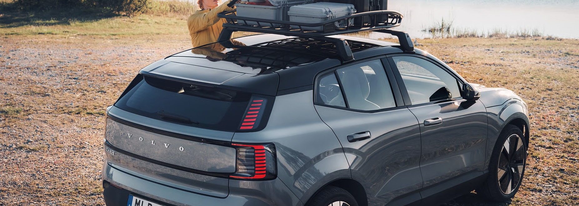 2026 Volvo EX30 at Delaney Volvo Cars Greensburg in Greensburg, PA | Woman. loading stuff on the roo…