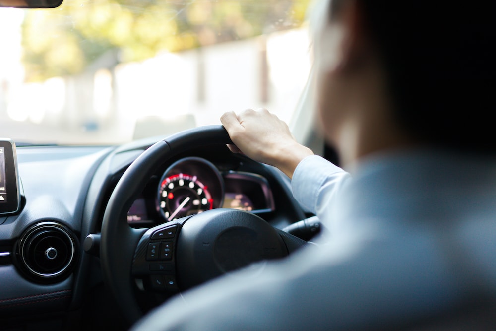 Rear View of Driver Taking Test Drive