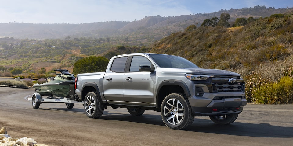 Grey 2023 Chevy Colorado hauling watercross