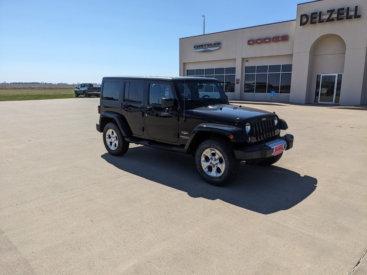 Used 2015 Jeep Wrangler Unlimited Sahara with VIN 1C4BJWEG8FL606653 for sale in Wapello, IA