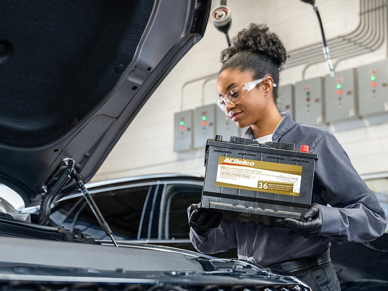  Person cheerfully signing documents.