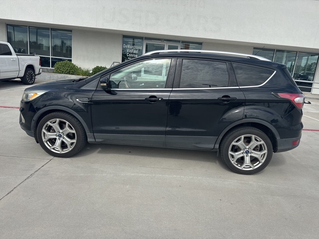 Used 2017 Ford Escape Titanium with VIN 1FMCU0J91HUB52321 for sale in Conroe, TX