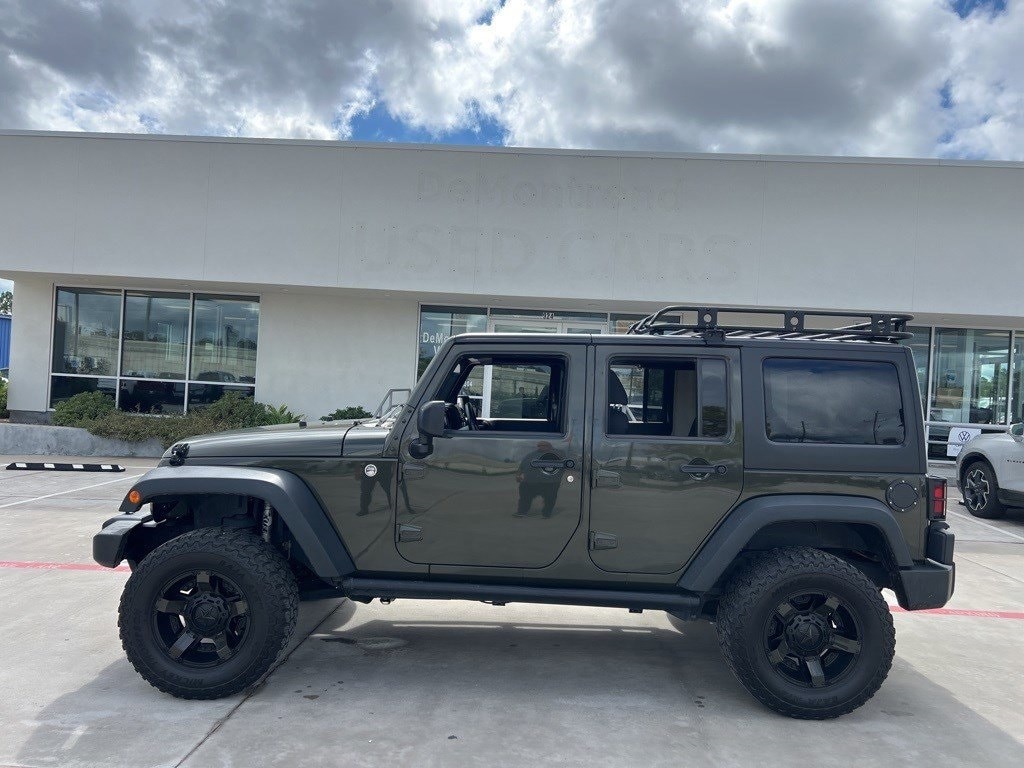 Used 2015 Jeep Wrangler Unlimited Sport with VIN 1C4BJWDG9FL585815 for sale in Conroe, TX