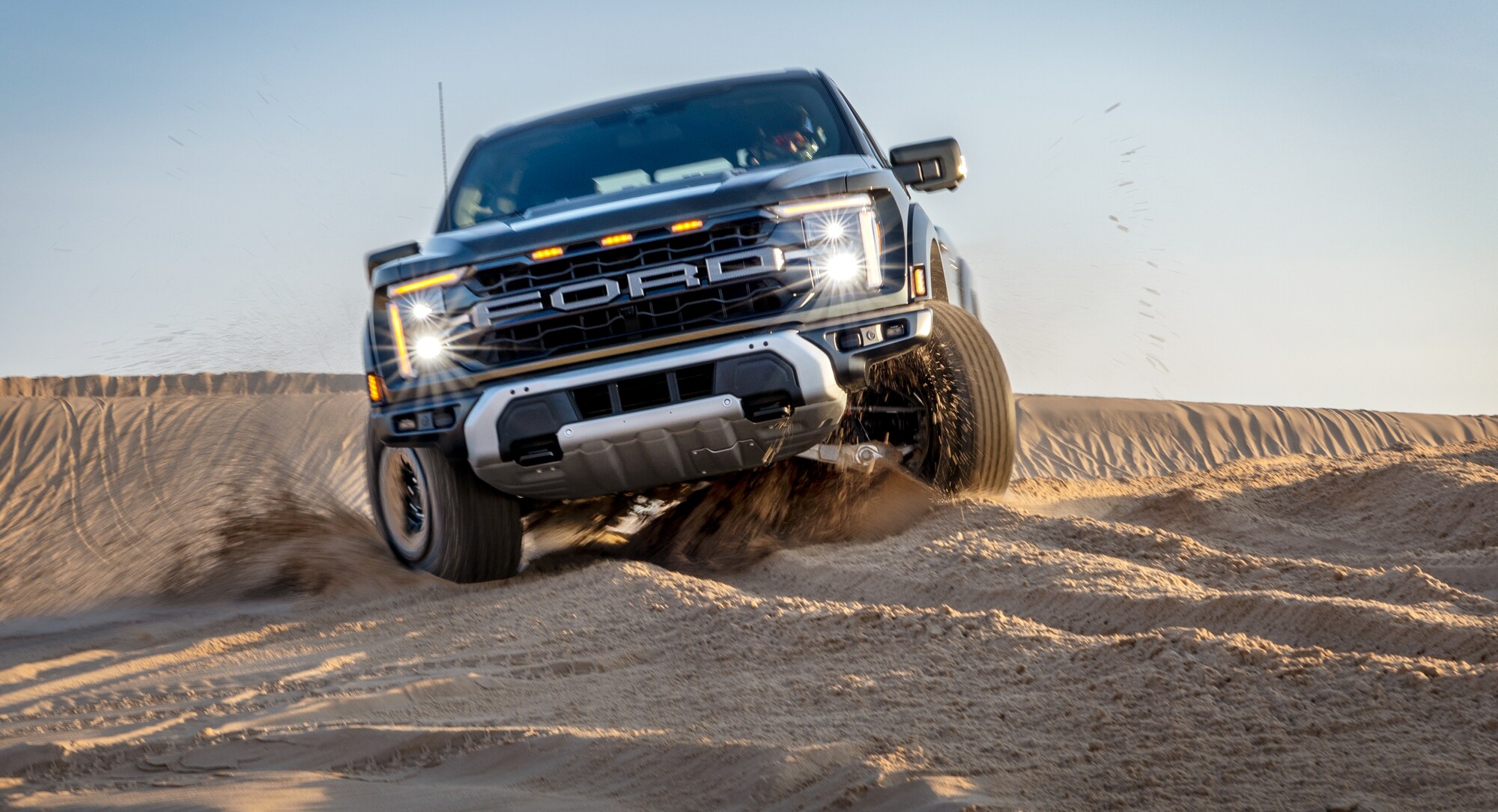 2025 Super Duty® hitched to a horse trailer with a horse and person at the back.
