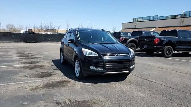 Used 2016 Ford Escape Titanium with VIN 1FMCU9JX0GUA93084 for sale in Southgate, MI