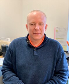 Staff member JOHN TOMLIN from 92cf29c9c0ce