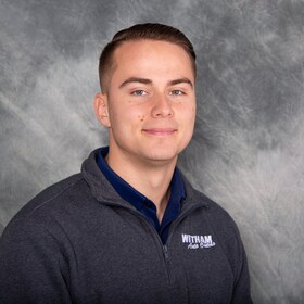 Staff member Cael Rhea from 371f44457580