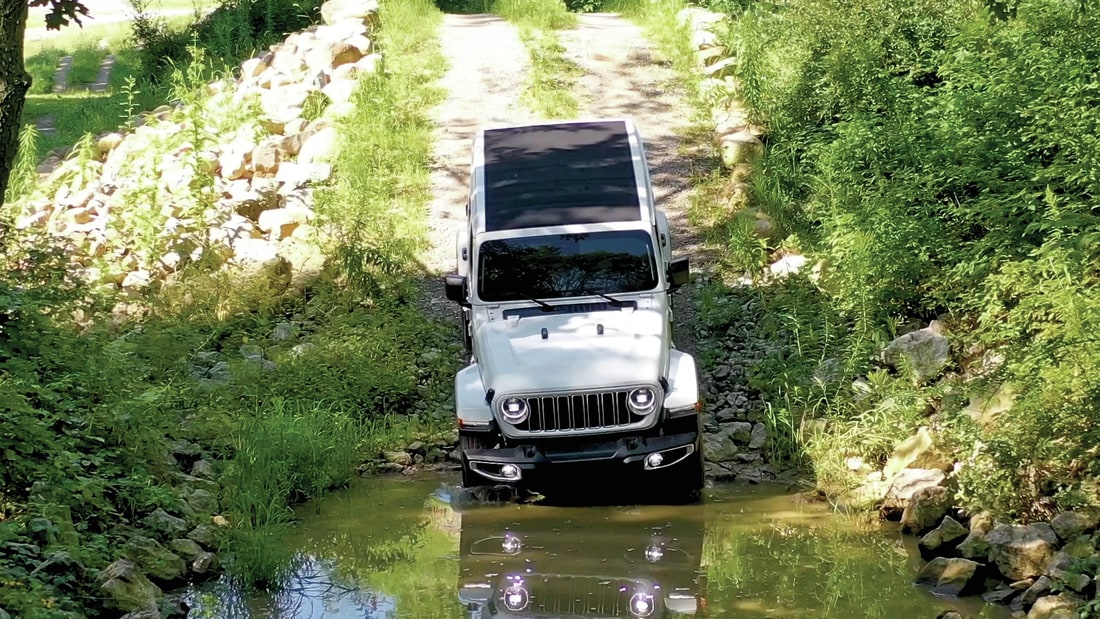 Aerial View of Jeep Wrangler entering a creek crossing
