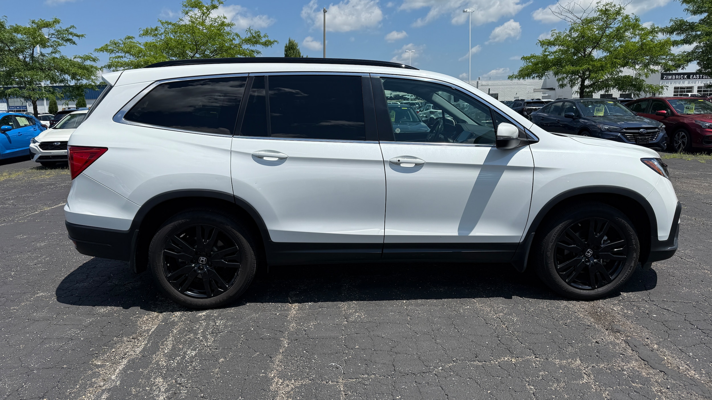 Used 2021 Honda Pilot SE with VIN 5FNYF6H20MB028379 for sale in Madison, WI