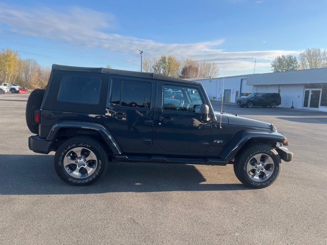 Used 2016 Jeep Wrangler Unlimited Sahara with VIN 1C4BJWEG0GL327005 for sale in Houghton Lake, MI