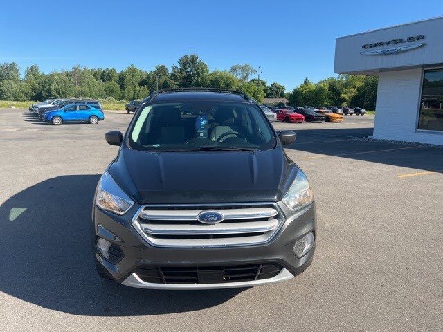 Used 2018 Ford Escape SE with VIN 1FMCU9GDXJUA05677 for sale in Houghton Lake, MI