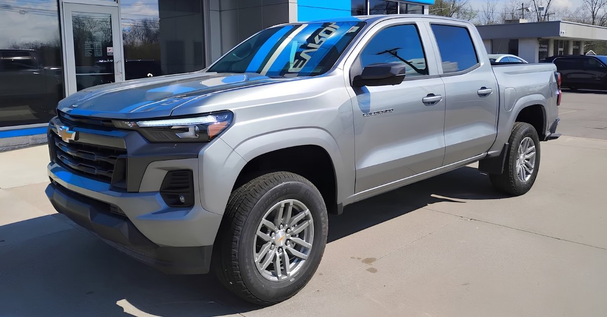 Silver 2026 Chevrolet Colorado LT pickup truck parked Jay's Chevrolet GMC's lot in a three-quarter front view on a sunny day.
