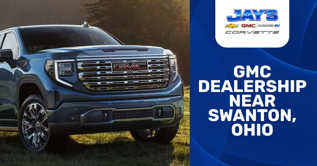 Promotional banner for Jay’s Chevrolet GMC featuring a dark blue GMC Sierra Denali truck on grass with dealership branding and bold text reading GMC dealership near Swanton, Ohio.