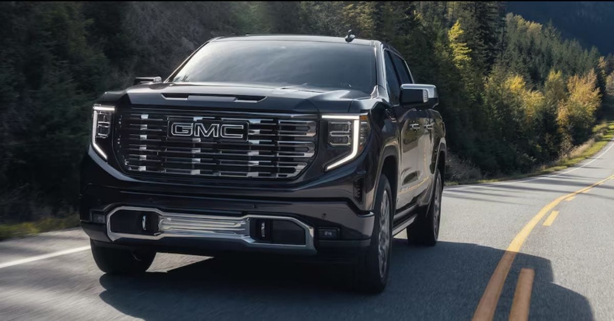 Black GMC Sierra 1500 driving