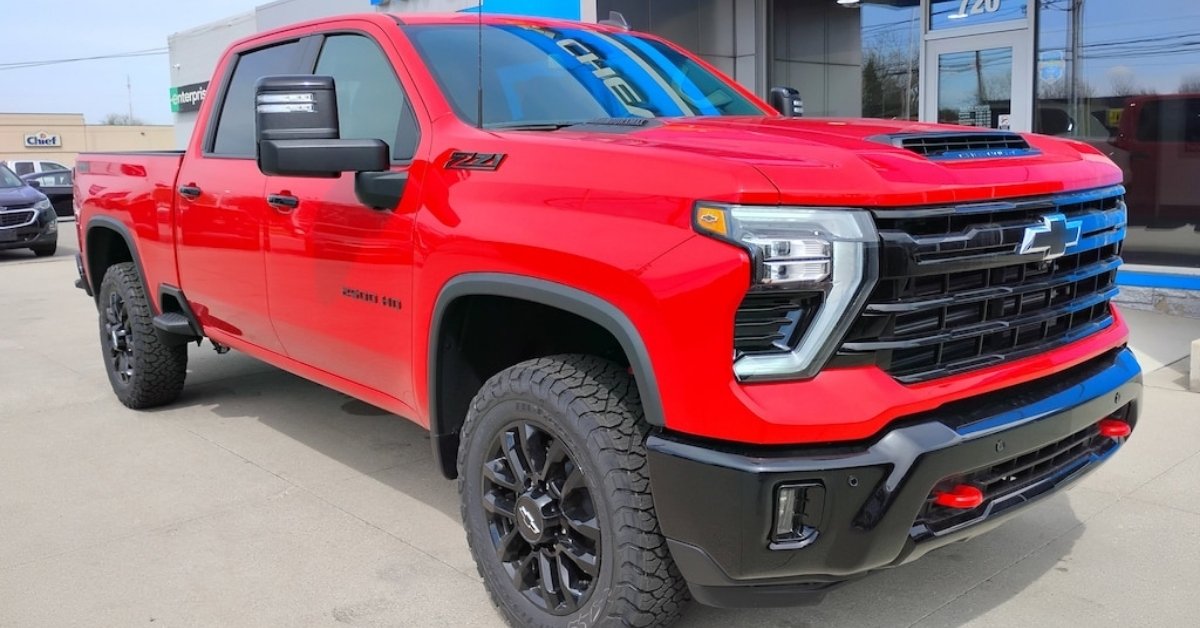 Red 2026 Chevrolet Silverado 2500 HD Z71 pickup truck with black grille and wheels, parked outside Don's Chevrolet GMC in Wauseon, OH in a front three-quarter view.