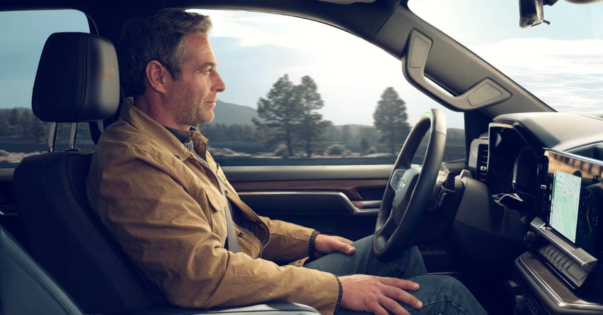 man driving Chevrolet vehicle