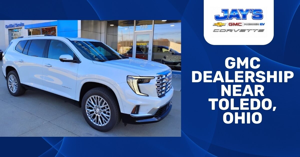 Promotional dealership graphic featuring a white GMC SUV parked outside Jay’s Chevrolet GMC dealership, with bold text reading “GMC Dealership Near Toledo, Ohio.”