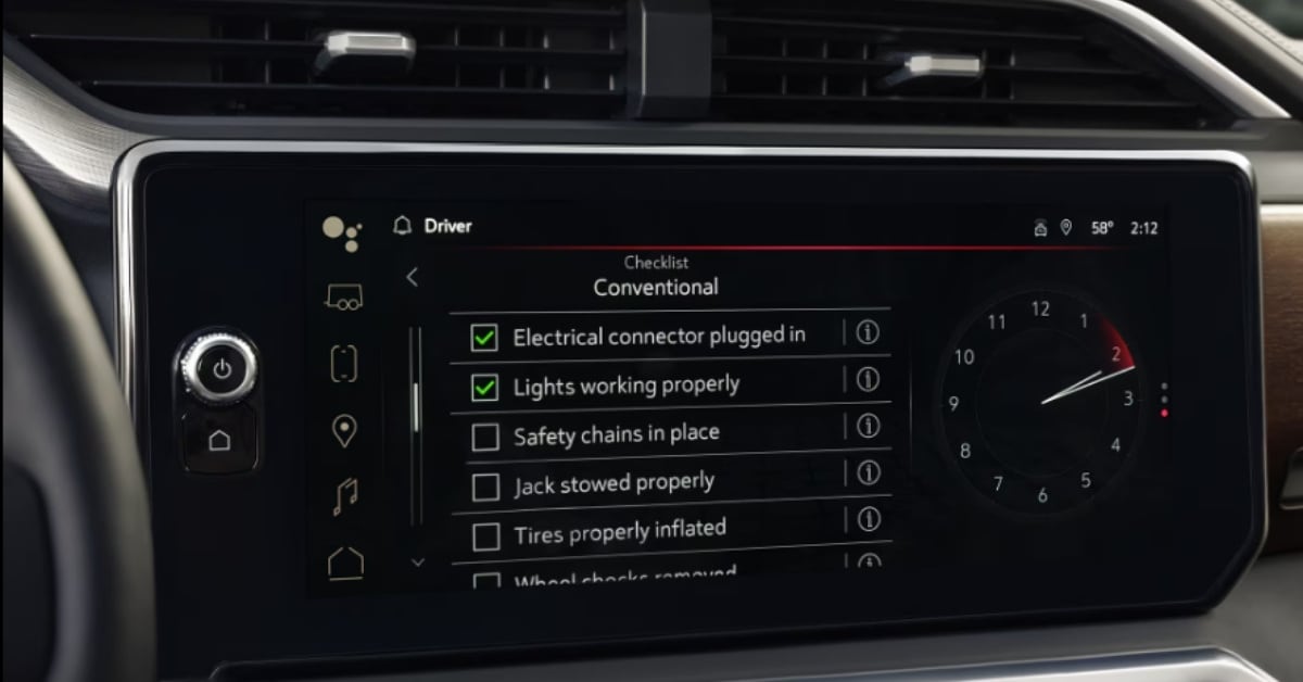 A 2026 GMC Sierra 1500 infotainment system displaying a towing checklist for 