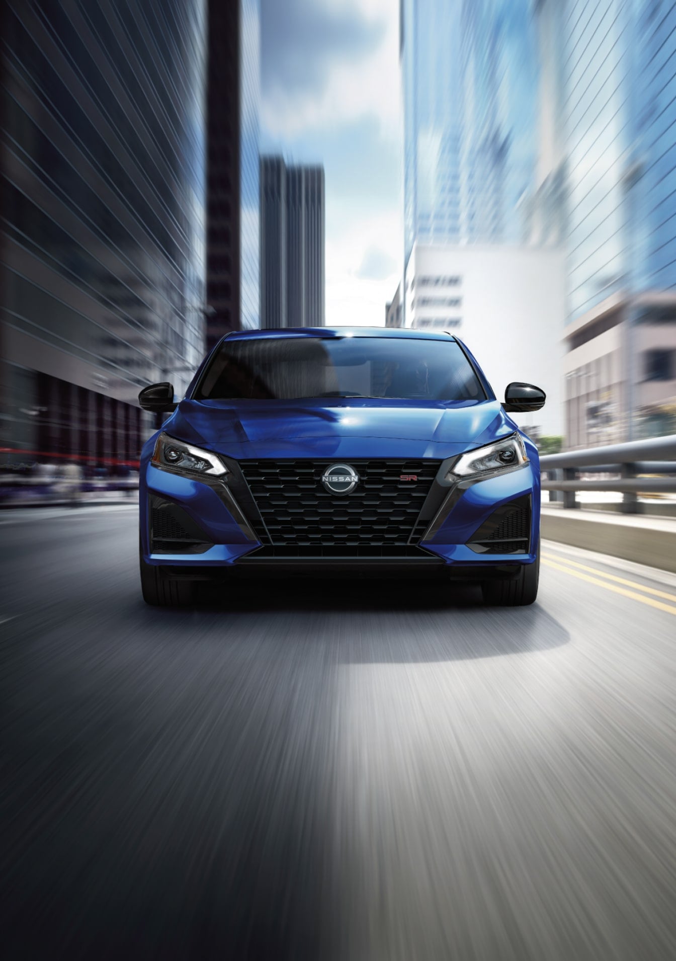 Blue Nissan Altima Driving in City Landscape