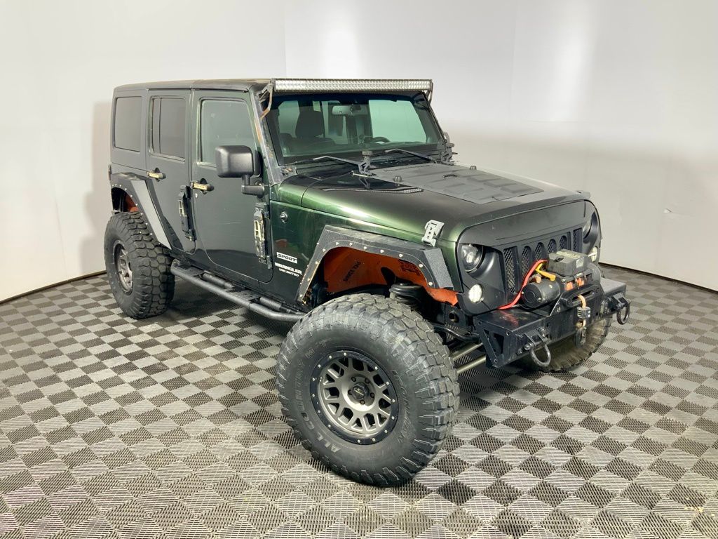 Used 2011 Jeep Wrangler Unlimited Sport with VIN 1J4BA3H17BL592996 for sale in Athens, OH