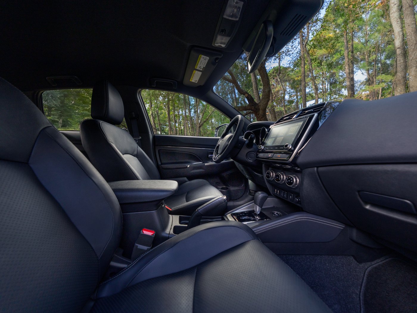 The front seats, center console and dashboard of the Outlander Sport, seen from the passenger side
