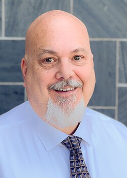 Staff member John Limb from ID_0ac629fd8a68