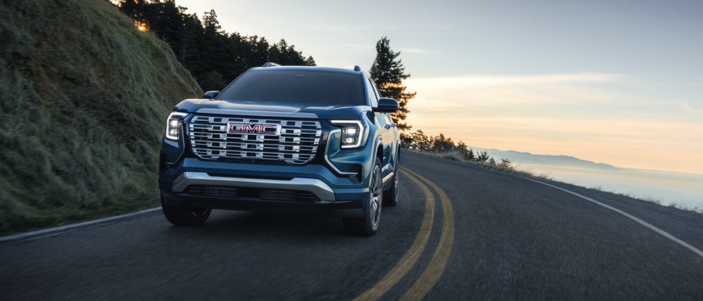 2026 GMC Terrain Exterior Driving On A Curved Road