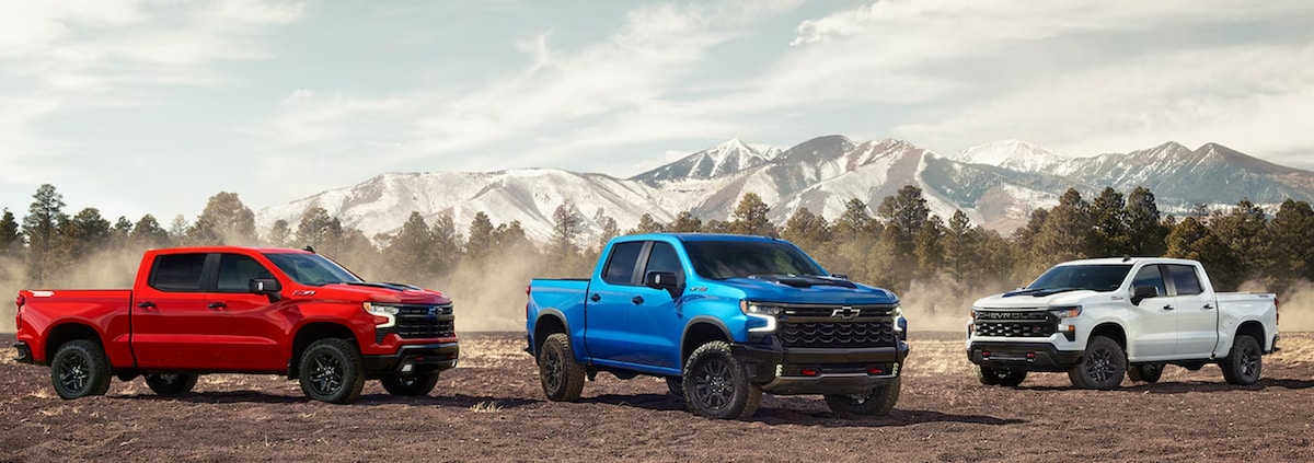  three 2024 Chevy Silverado 1500 trucks lined up