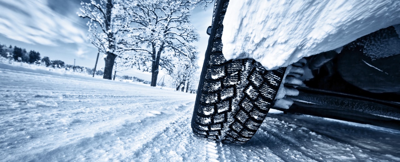car tires on snow covered road