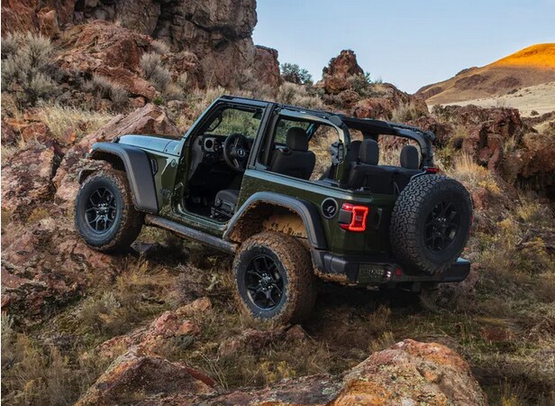 2024 Jeep Wrangler Driving Through Rocky Terrain