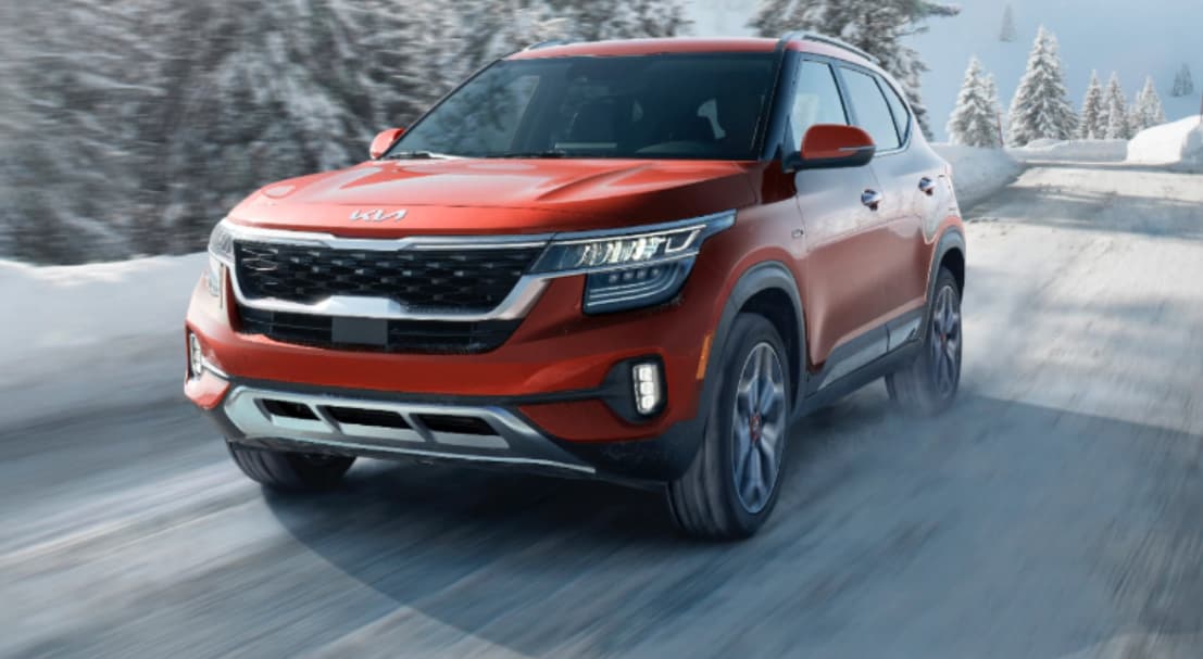 2023 Kia Seltos Compact SUV driving in the snow