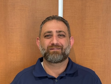 Staff member Khalid Hadad from ID_7574389cc1a4