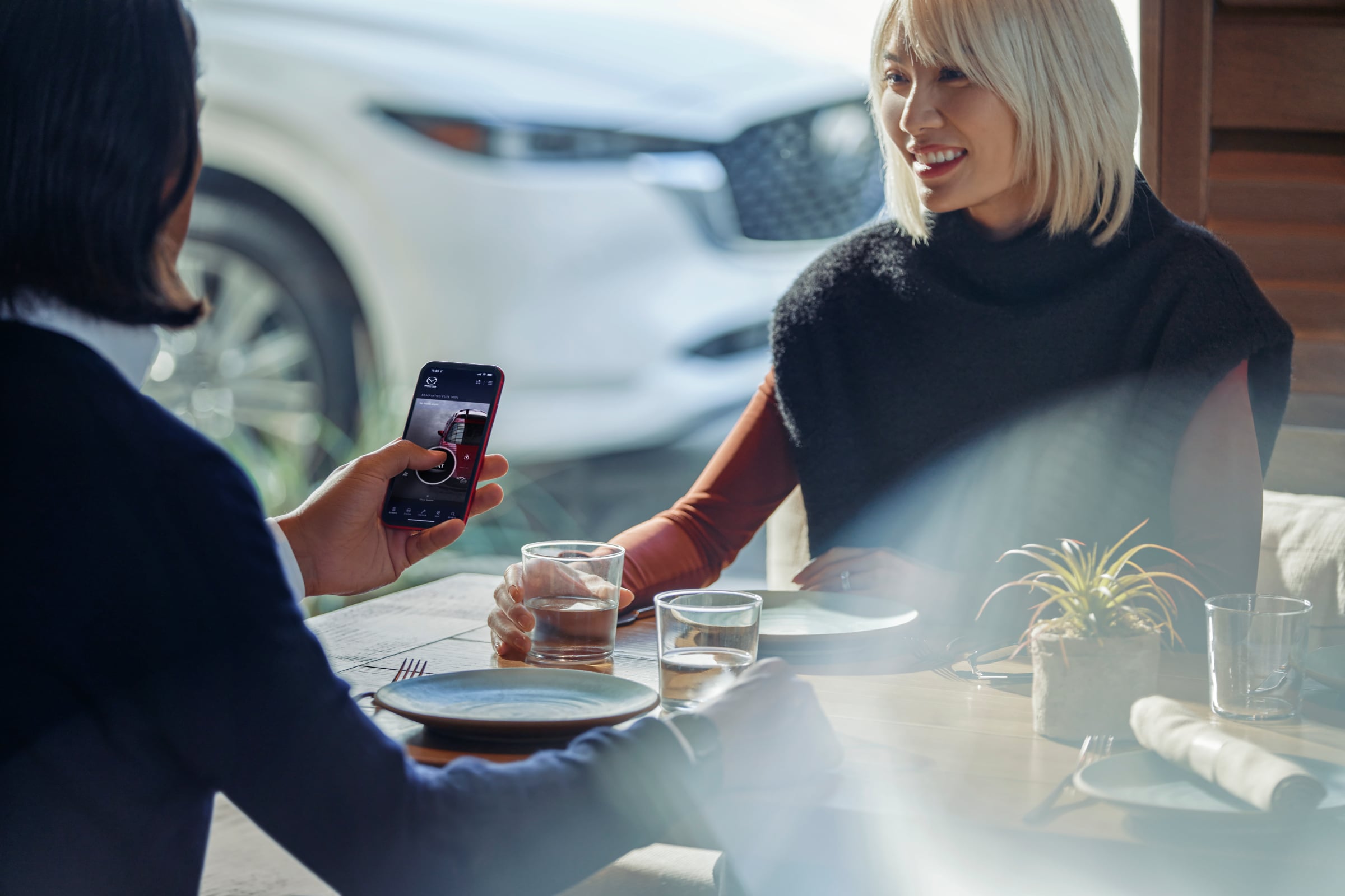Woman using Mazda Connected Service App
