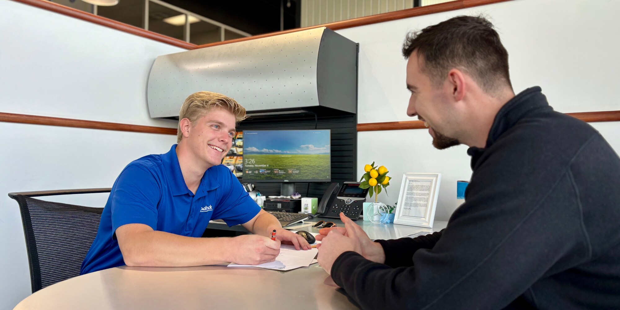  Successful D-Patrick Car Salesman with a Customer