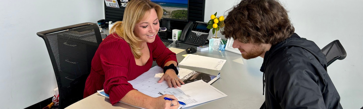  D-Patrick Car Saleswoman showing paperwork