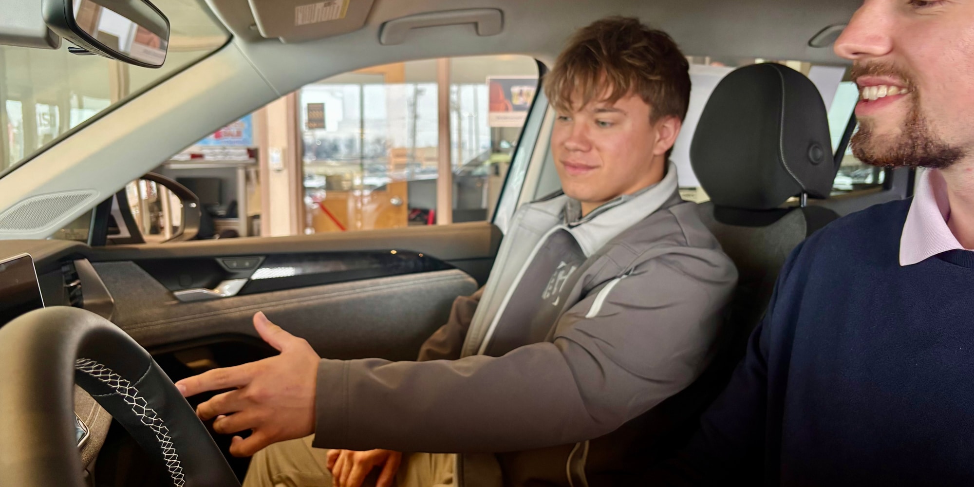 Car Salesman Showing Features of Car