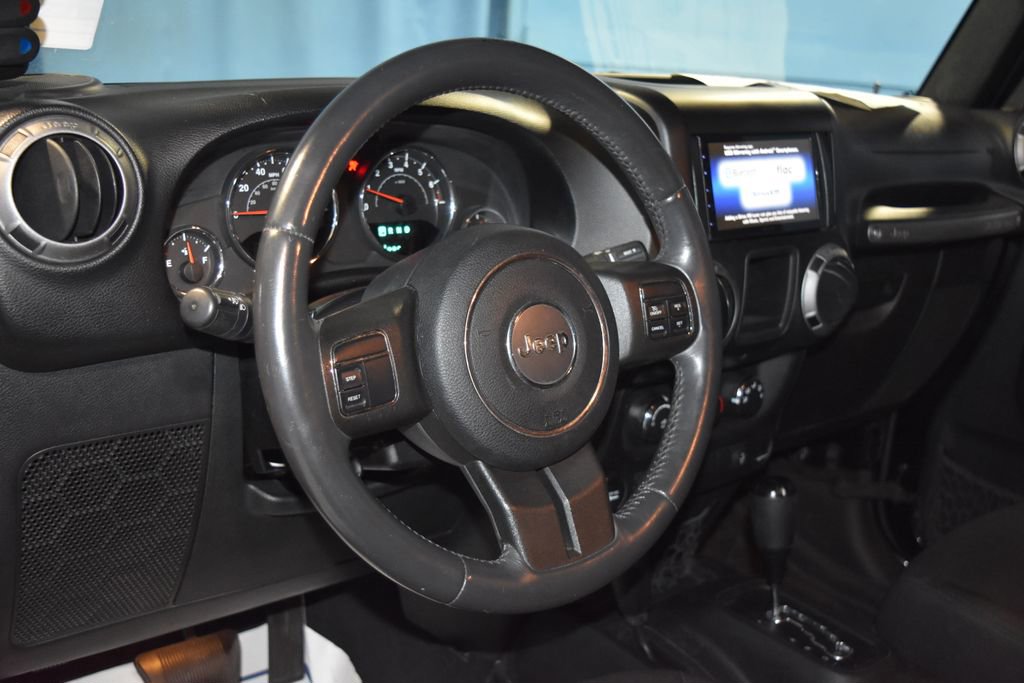 Used 2015 Jeep Wrangler Unlimited Sport with VIN 1C4BJWDG9FL501296 for sale in Evansville, IN