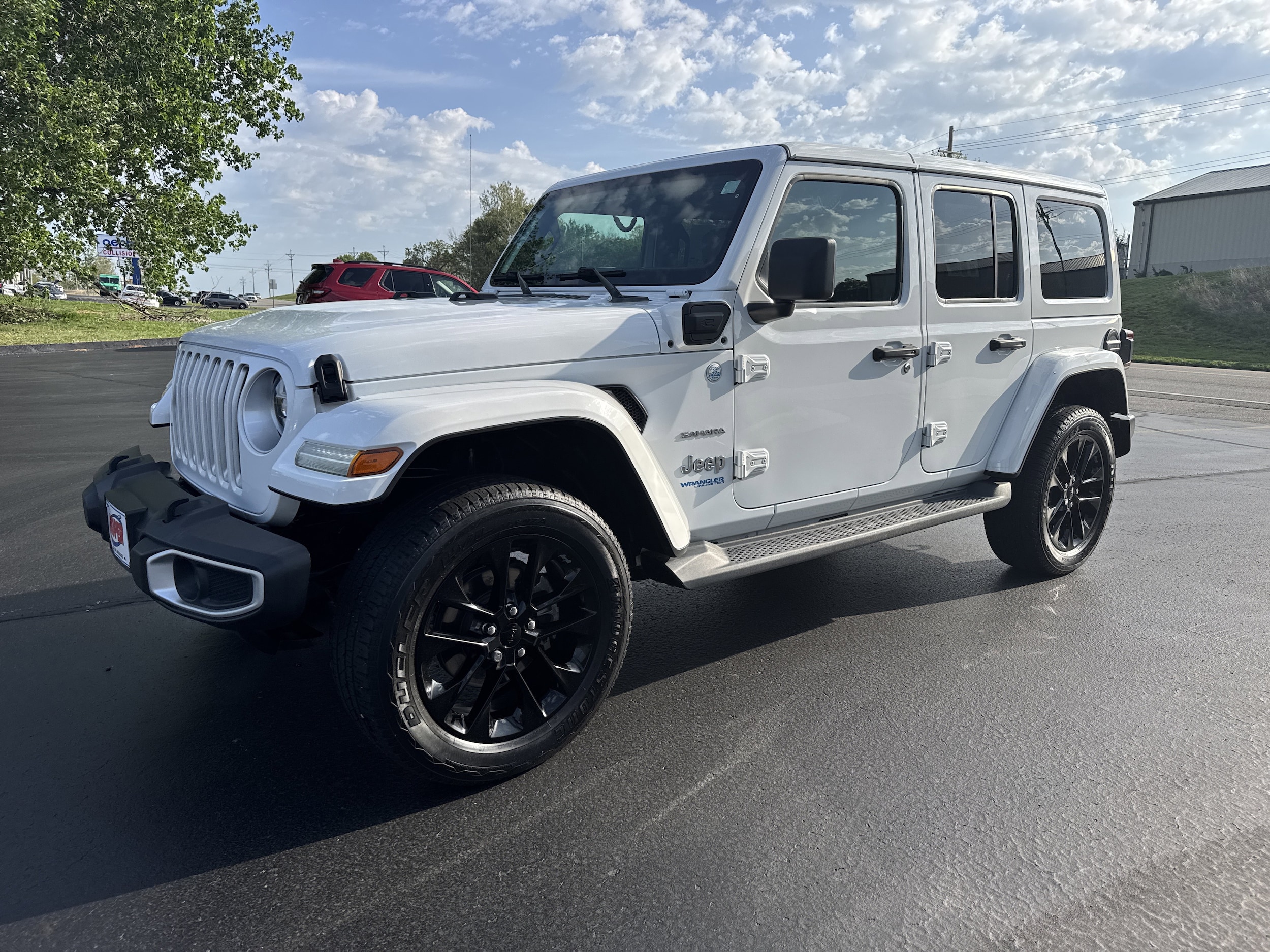 Used 2021 Jeep Wrangler Unlimited Sahara 4XE with VIN 1C4JJXP6XMW802269 for sale in Joplin, MO