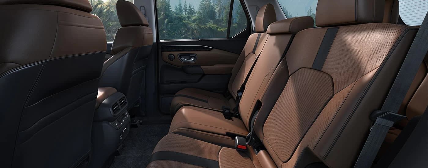 A close up shows the brown seats in a a 2023 Honda Pilot.