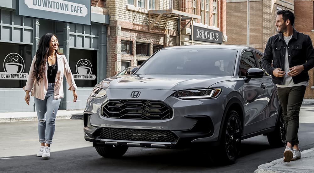A grey 2023 Honda HR-V is shown parked on the side of a city street after leaving a Honda dealer in Monroe, LA.