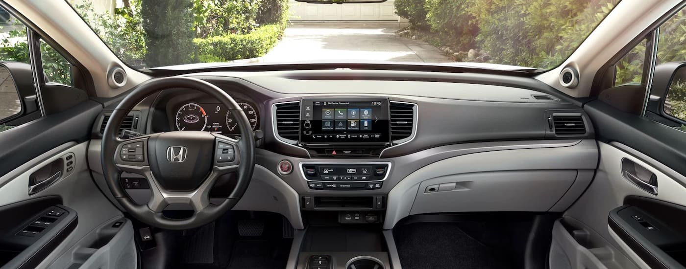 The grey interior of a 2024 Honda Ridgeline is shown from above the center console.