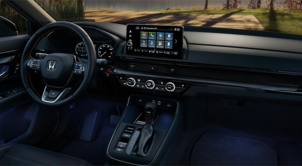 The dashboard and infotainment screen is shown in a 2023 Honda CR-V Touring Sport for sale.