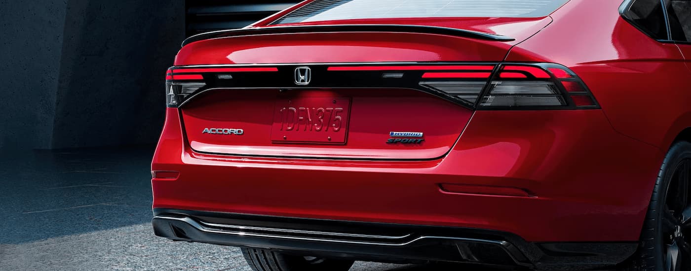 The trunk of a red 2023 Honda Accord Sport Hybrid for sale is shown.