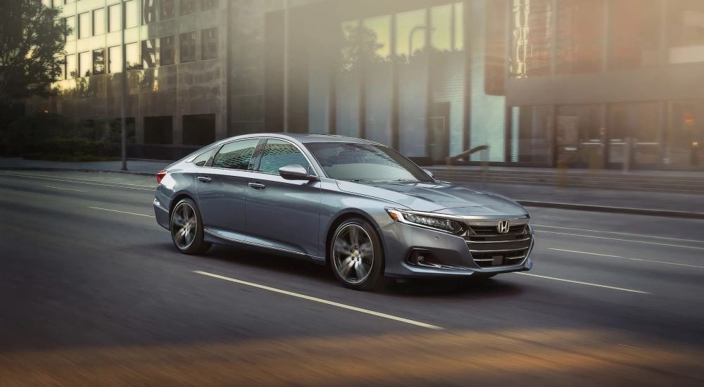 2021%20Honda%20Accord%20Touring%20-%20Driving%202.jpg A silver 2021 Honda Accord is shown driving on a city street.