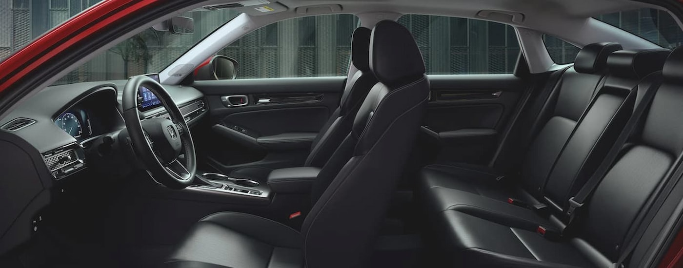 The black interior of a 2022 Honda Civic Touring for sale at a used Honda dealer near Calhoun.